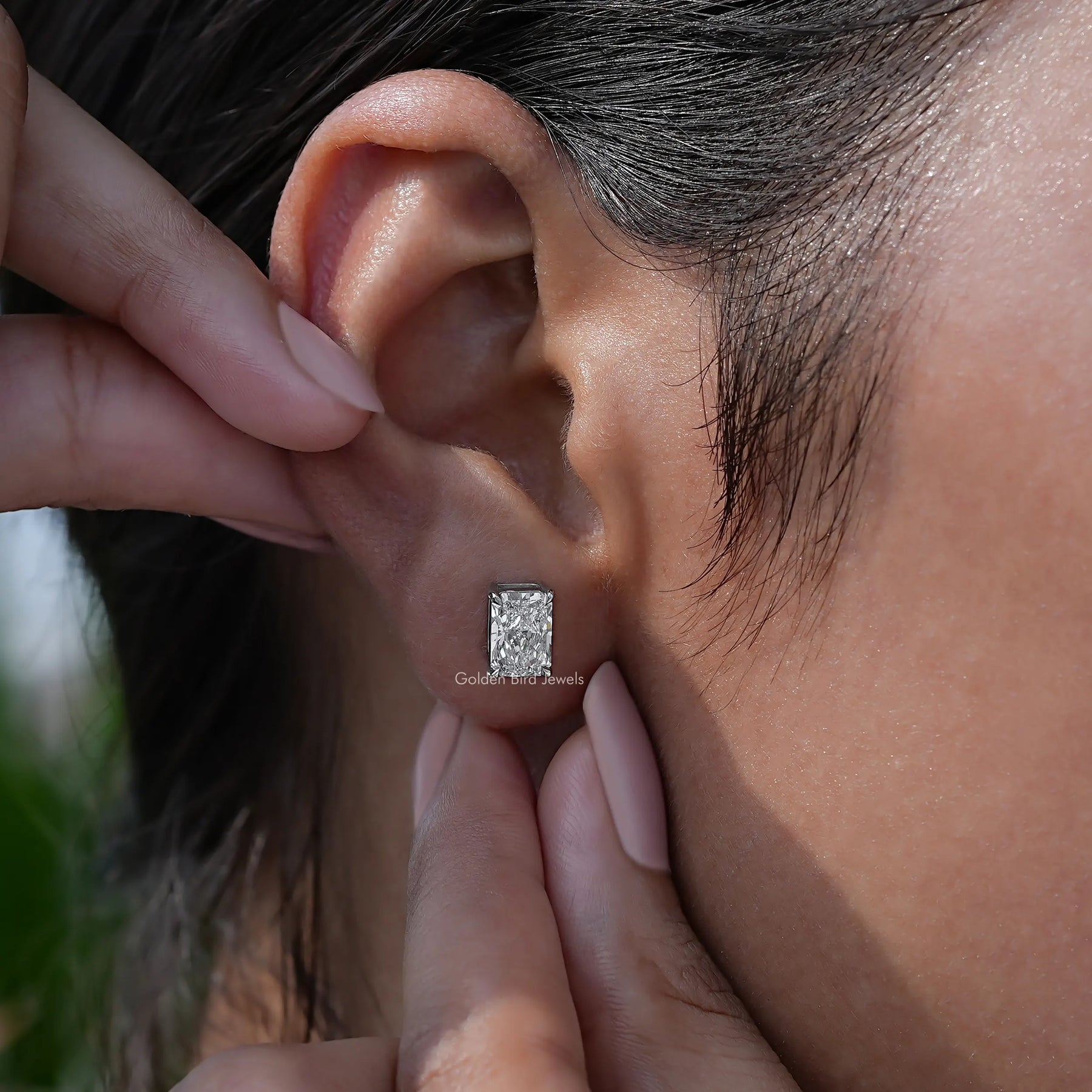 View of Stud earrings in halo radiant diamond 
