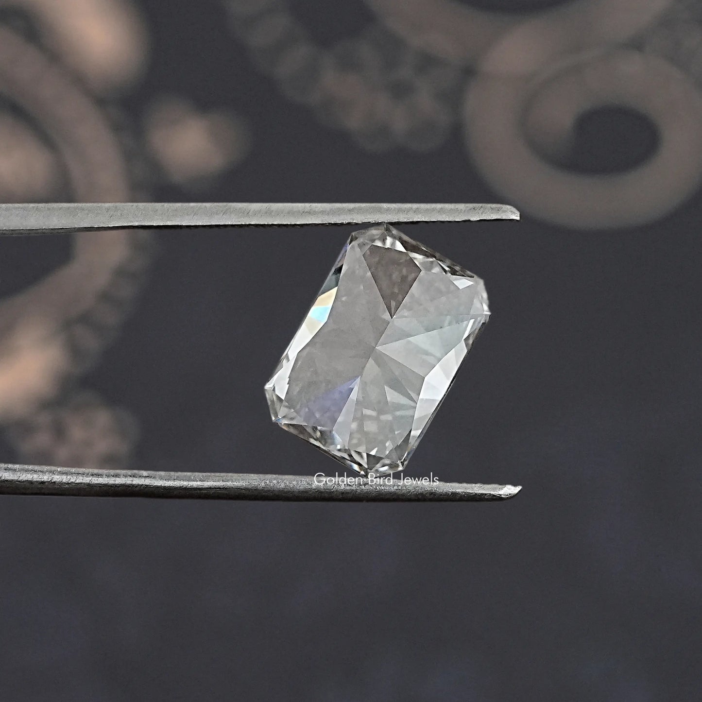 Twijer holding On the Radiant Cut Loose Lab Diamond