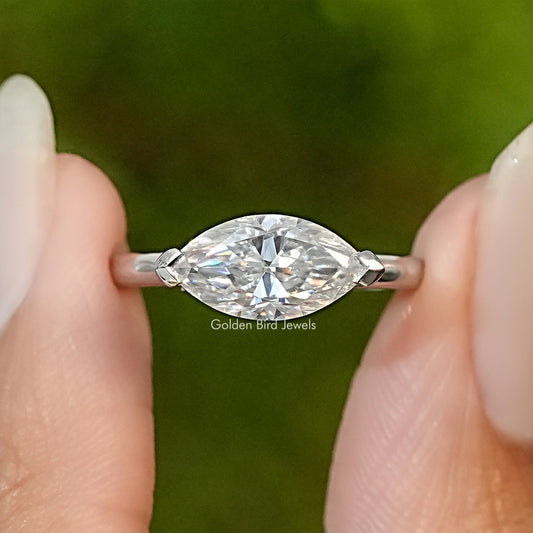 Marquise-cut moissanite engagement ring with oval marquise stone and prong-set band