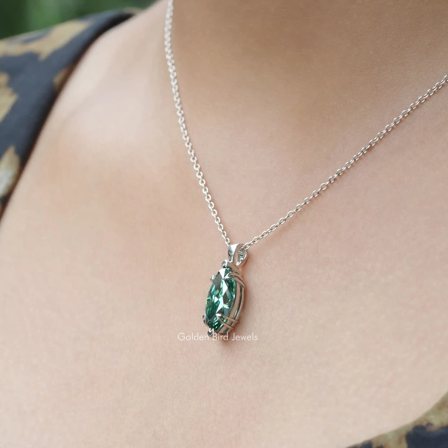 Full view of moissanite pendant in unique shape 