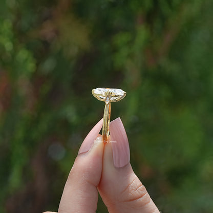 Marquise moissanite ring shown edge-on, with a raised setting and narrow band