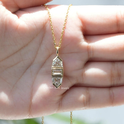 In hand showing view of moissanite pendant	 		
