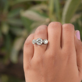 Close-Up View of Moissanite Round Cut Three Stone Engagement Ring In White Gold