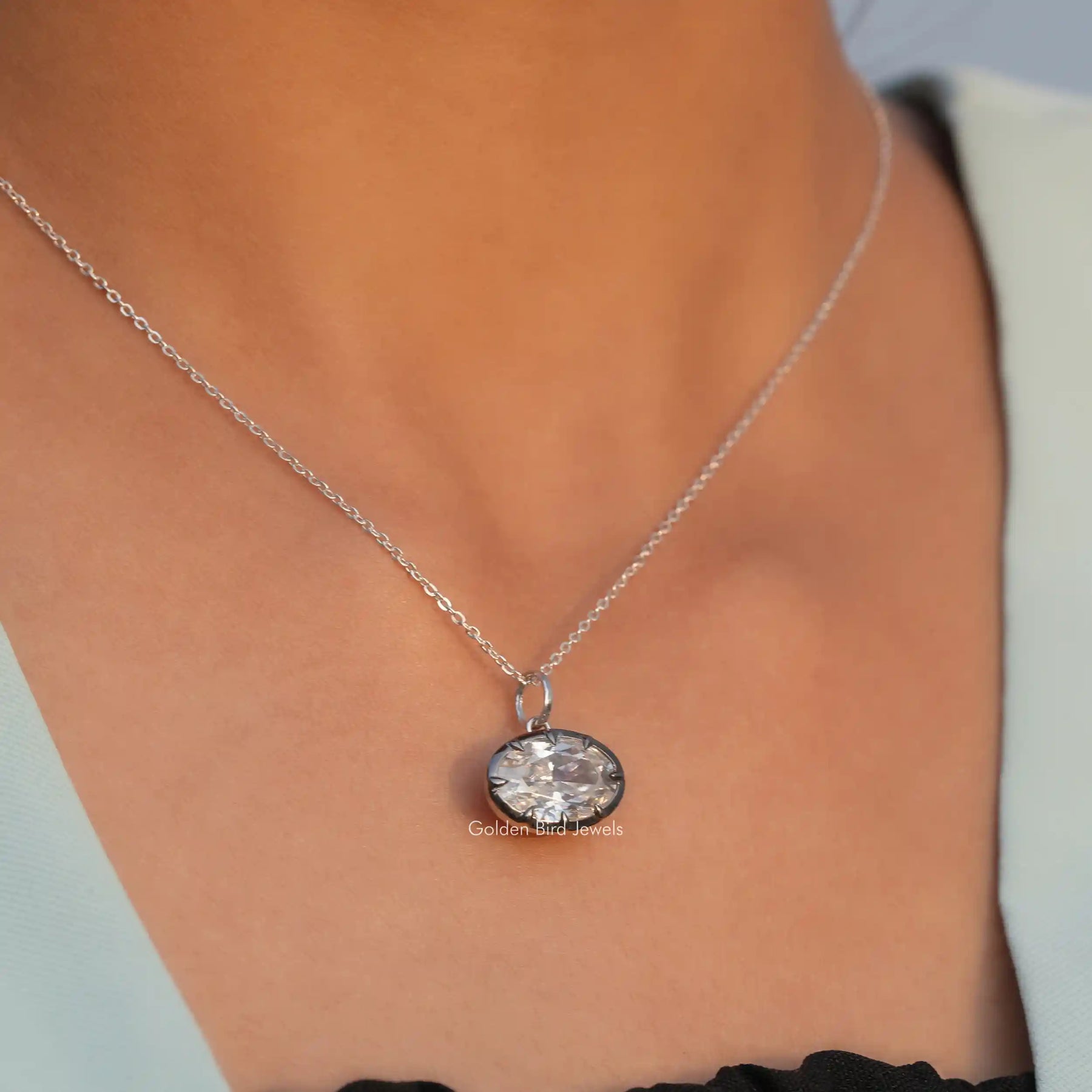 In front view of moissanite oval cut pendant