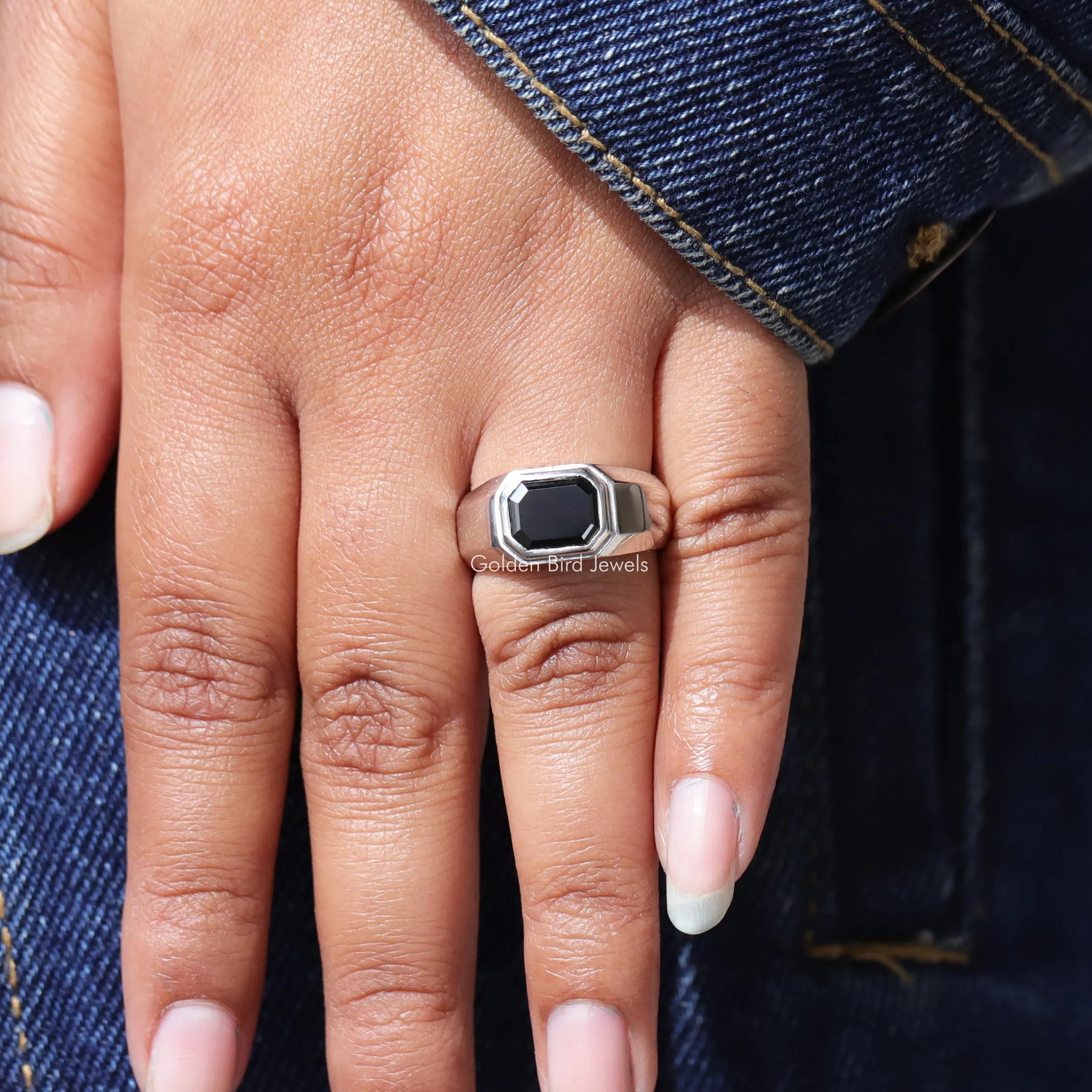 Close view of moissanite ring in secure setting 
