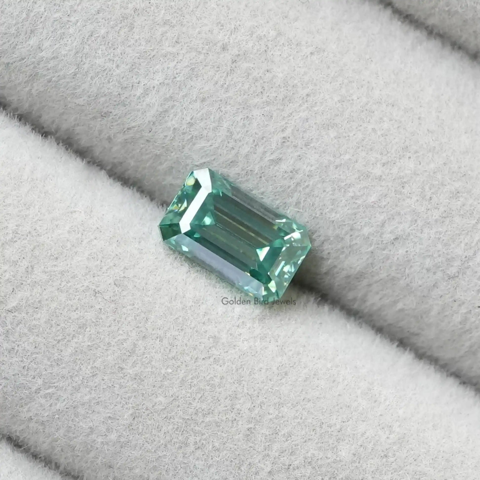 Close View Of Dark Green Emerald Shaped Loose Stone
