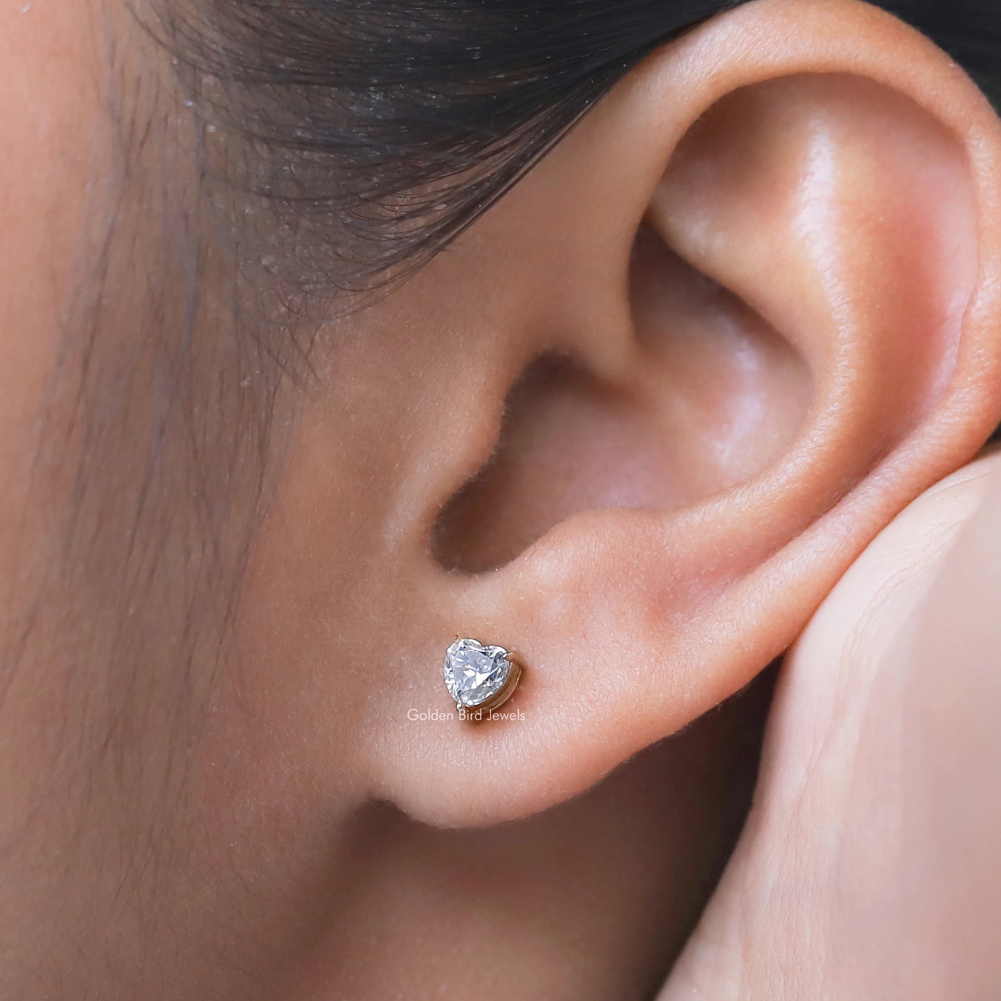 Detailed view of moissanite earrings in secure setting 
