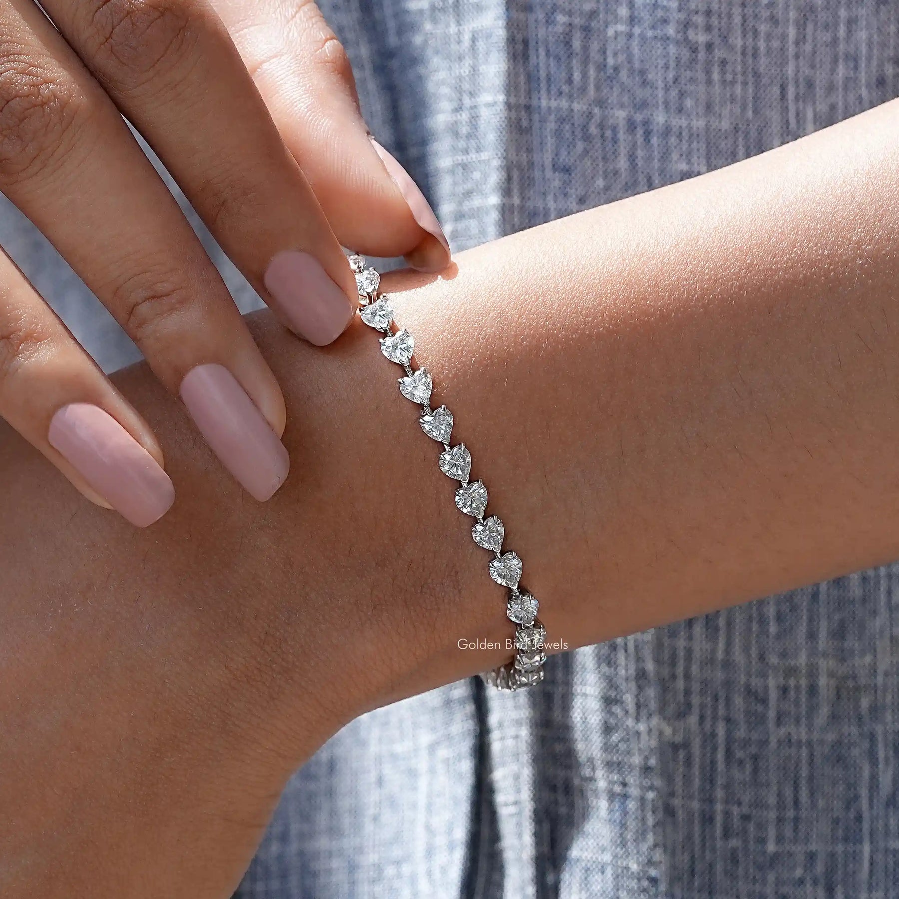 Detailed view of heart shaped moissanite bracelet
