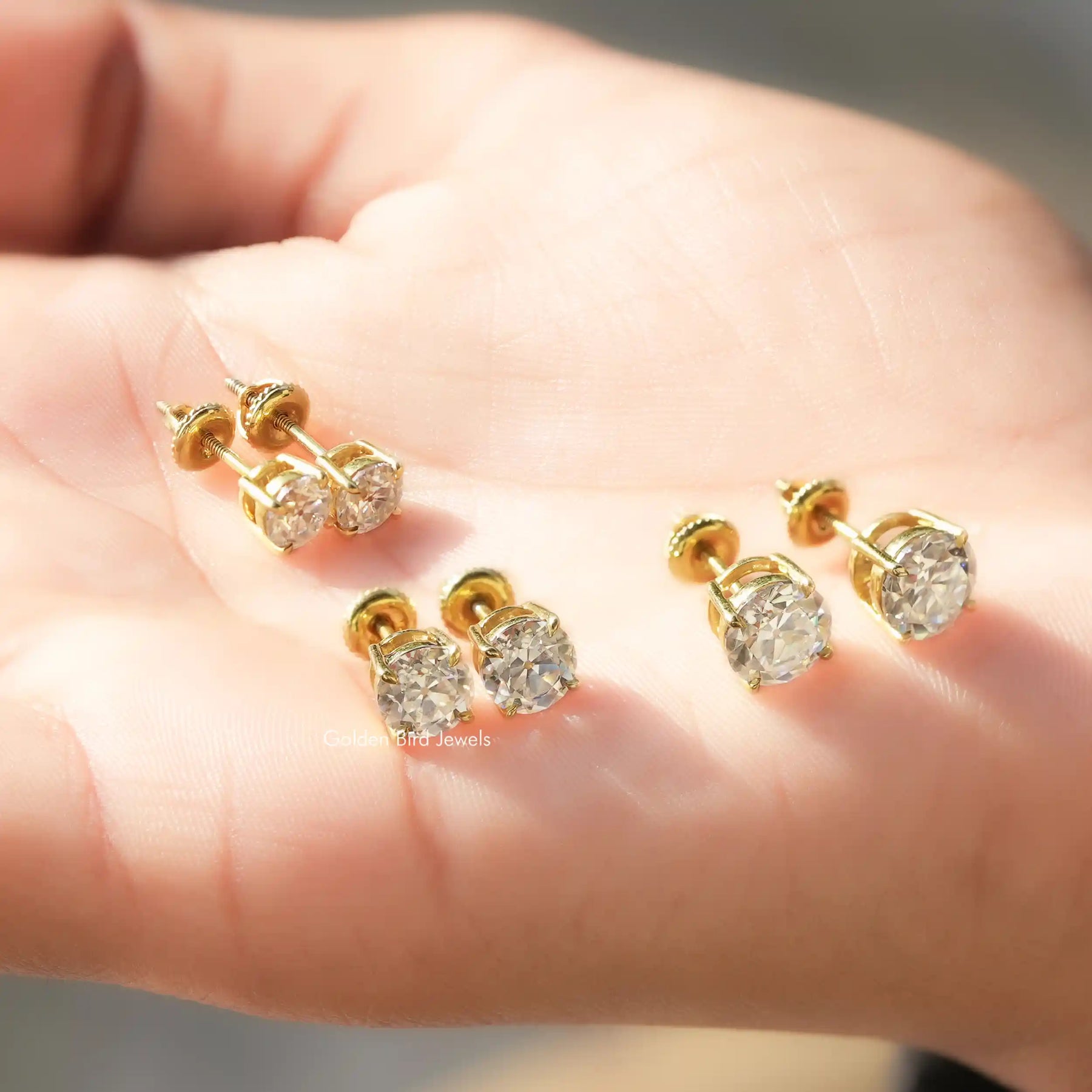 Front And Back Side View Of solitaire stud earrings crafted in moissanite stone 