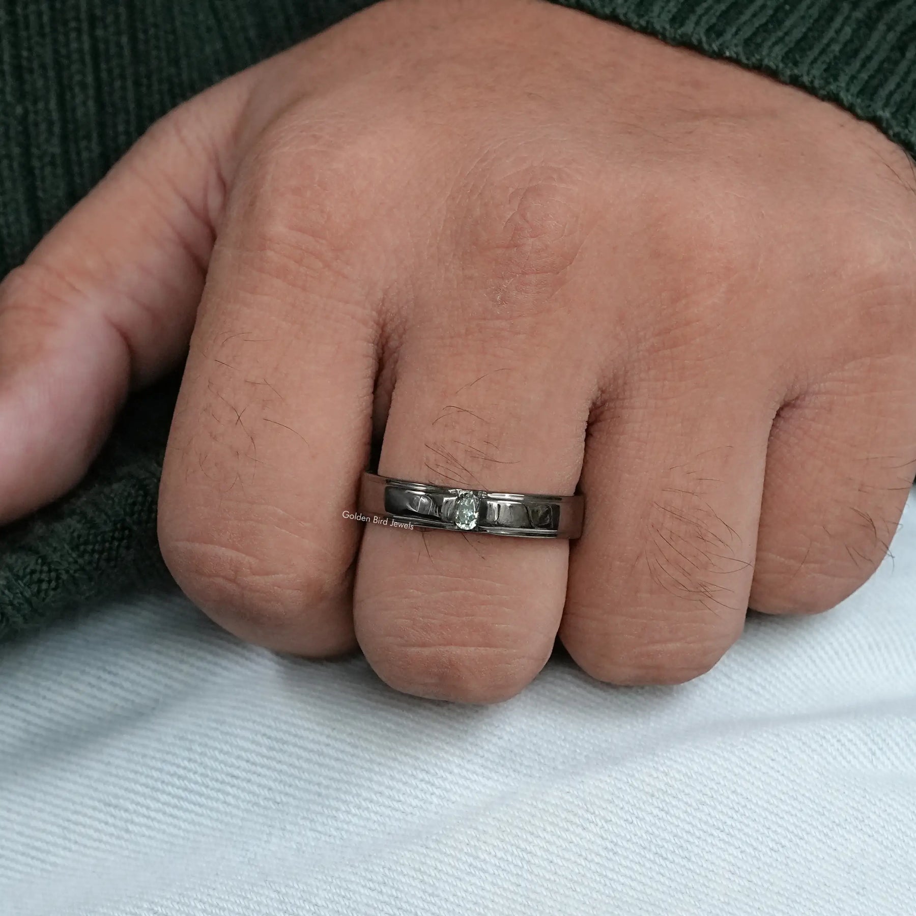 In hand showing view of moissanite Ring	 		
