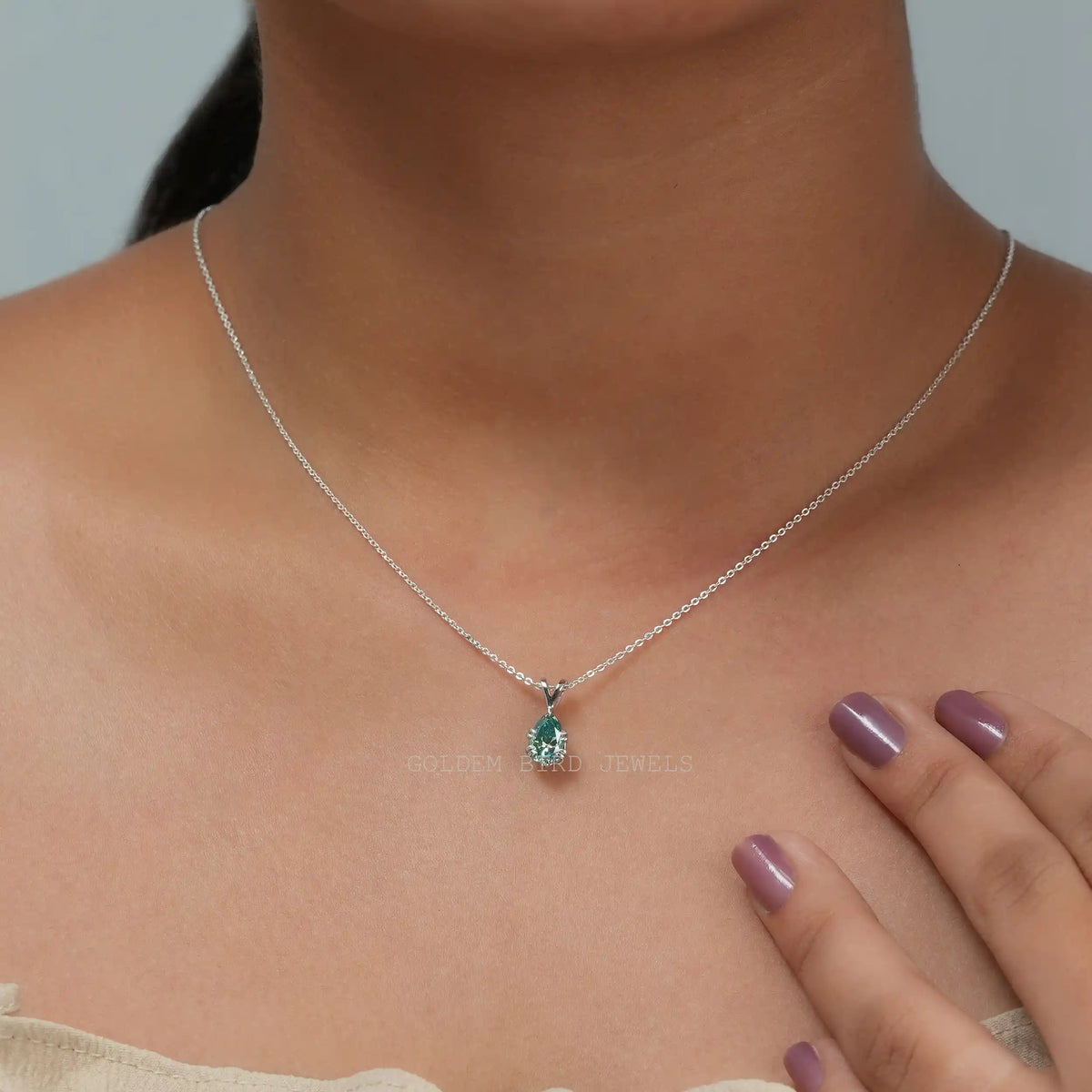 In neck front view of  pear cut moissanite pendant