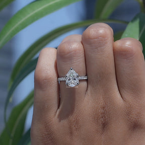 Front View of Pear Cut Moissanite Accent Ring In White Gold