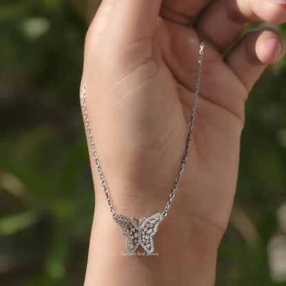 In hand showing view of moissanite pendant	 		