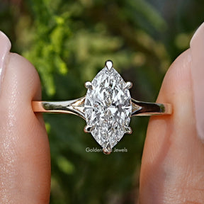 Marquise Cut Lab Grown Diamond Engagement Ring Held Between Fingers