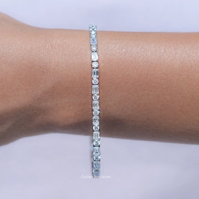 Close up View of Emerald and Round Cut Diamond Tennis Bracelet