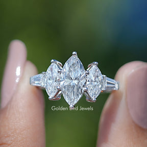 Marquise Lab Grown Diamond Five Stone Ring Held Between Fingers