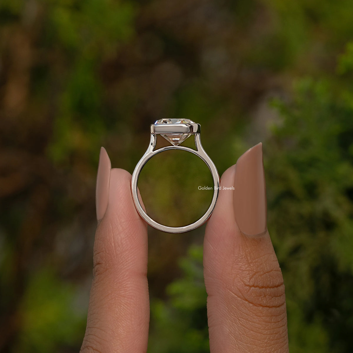 Sterling silver elongated cushion moissanite ring with bezel-set centerpiece
