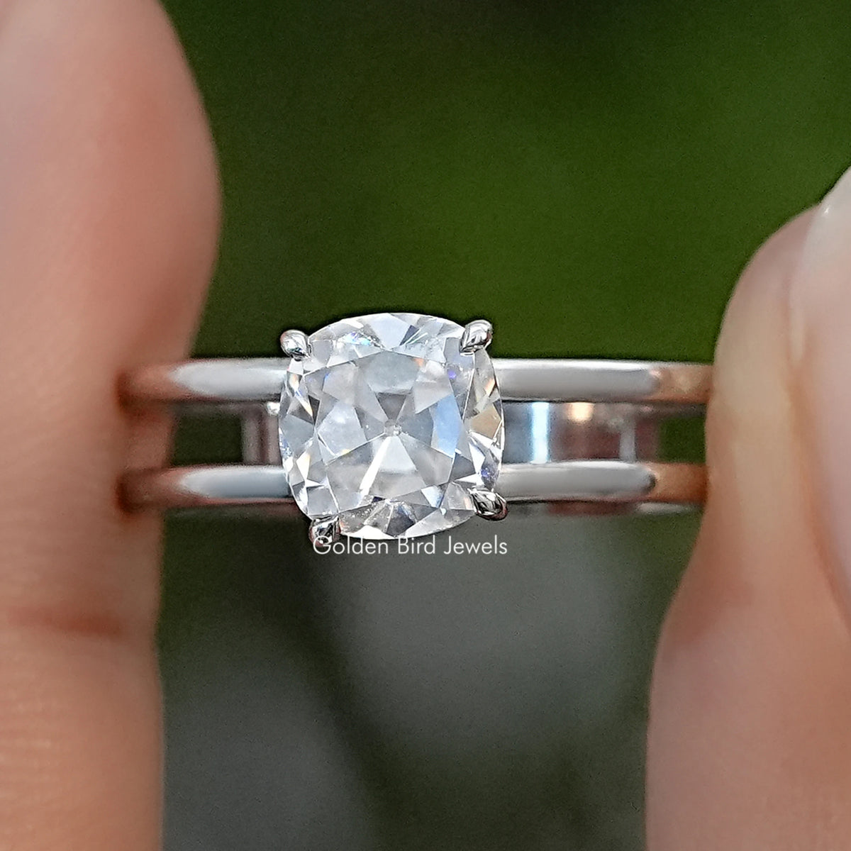 Sterling silver moissanite ring with a cushion-cut center stone and double-row band