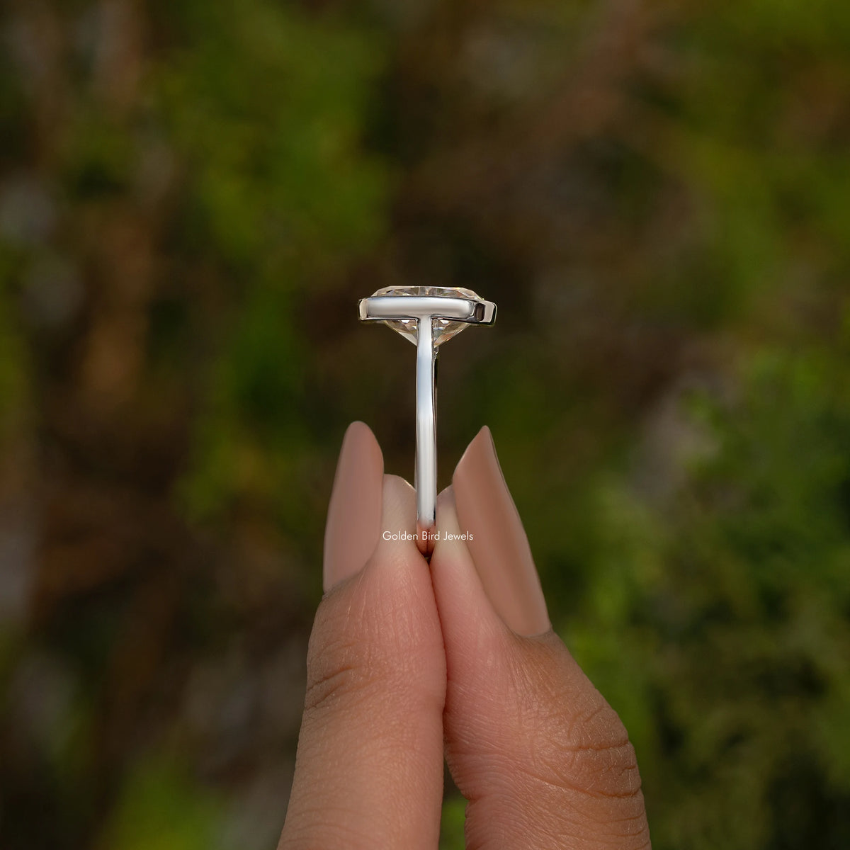 Sterling silver elongated cushion moissanite ring with tall prong setting, side view