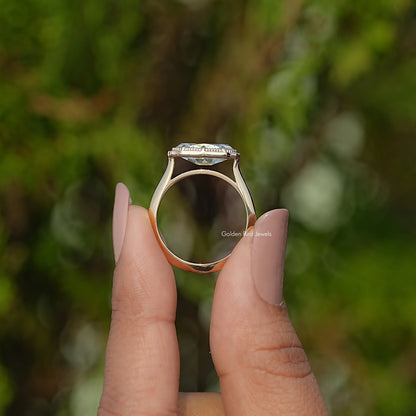 Gold-tone oval solitaire ring, underside view showing setting and band