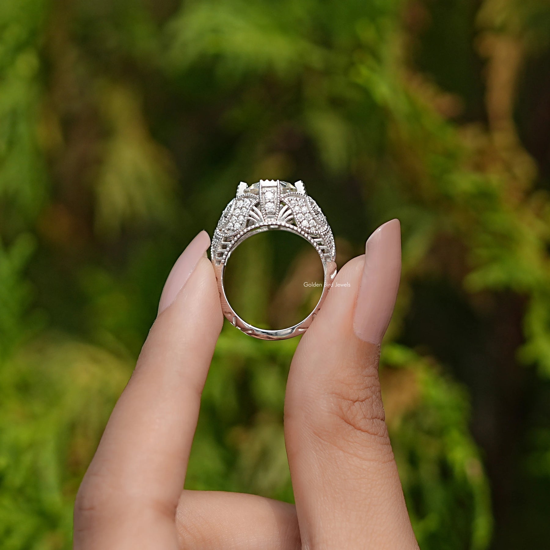 Back View of Old European Round Cut Moissanite Engagement Ring In two fingers