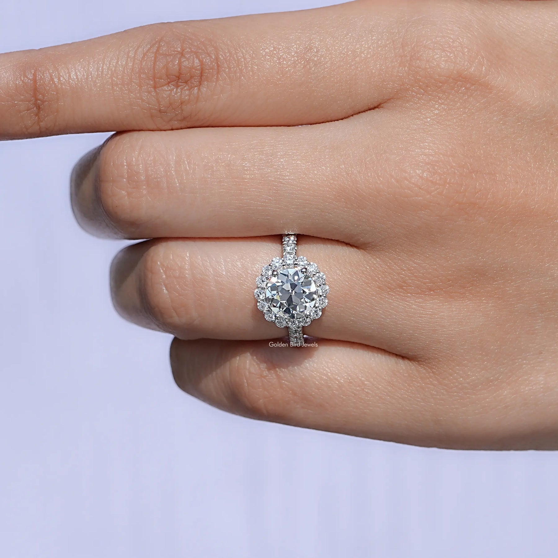 In finger front view of Old European Round Lab Diamond Accent Halo Wedding Ring in unique shape