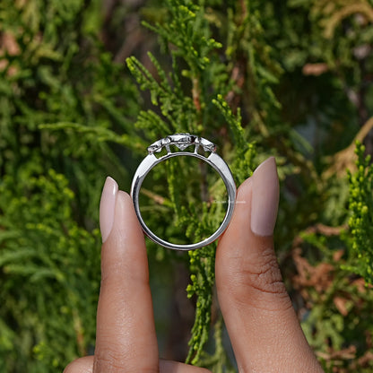 Back View of Old European Round Cut Diamond Three Stone Engagement Ring In two fingers