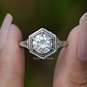 Front View of Old European Round Cut Moissanite Ring In two Fingers