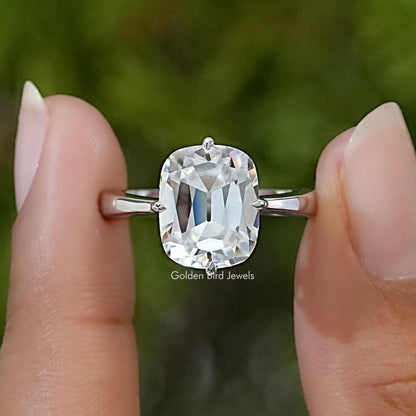 Sterling silver cushion moissanite solitaire ring with a large faceted center stone.