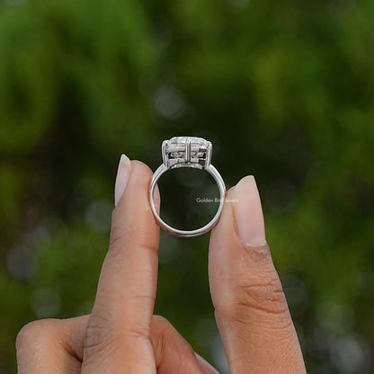 Sterling silver moissanite engagement ring viewed from the side, showing the raised setting and band.
