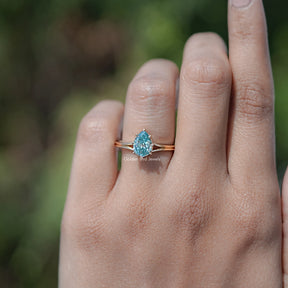 In finger front view of Pear Cut Moissanite Engagement Ring 