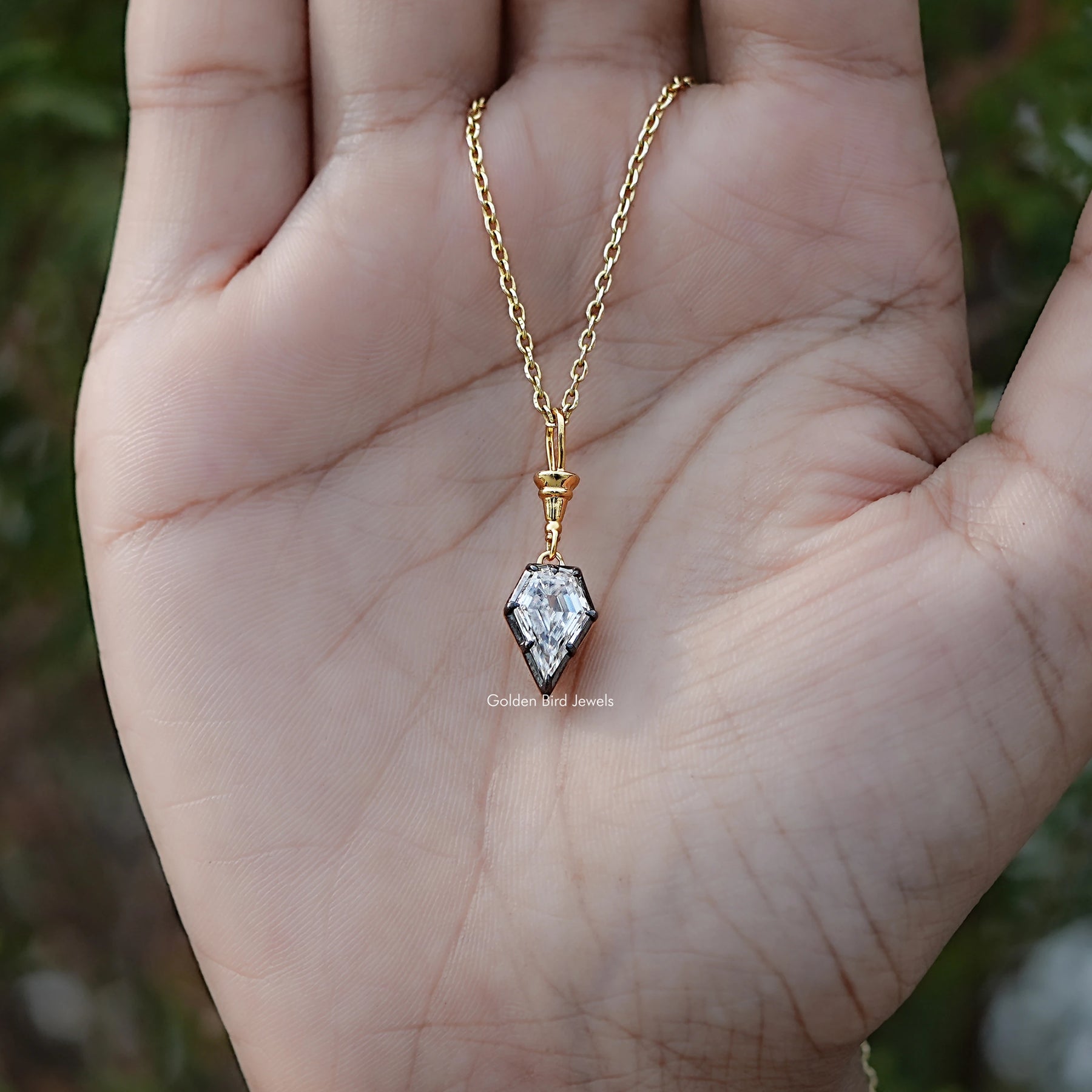 Close View Of Old Mine Shield Moissanite Pendant in Secure Setting 