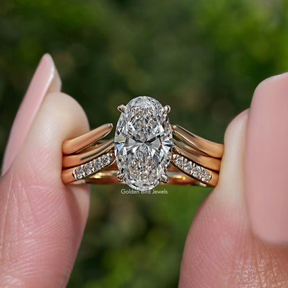 Gold-tone bridal ring set with oval lab diamond and tapered side accents
