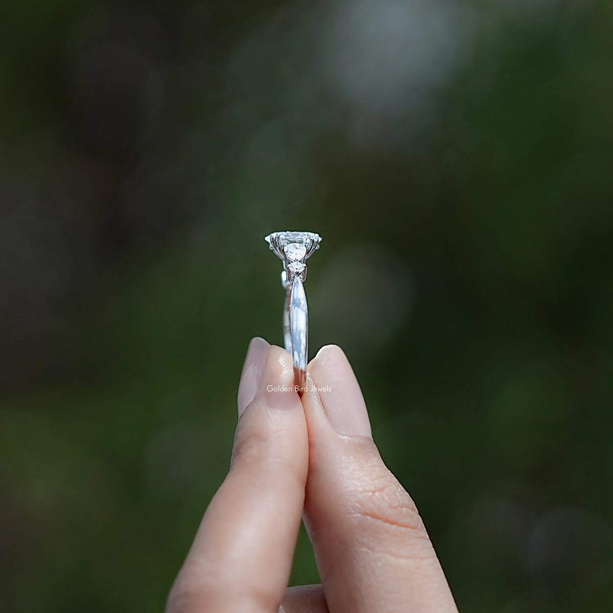 Side View of Oval And Pear Diamond Five Stone Engagement Ring