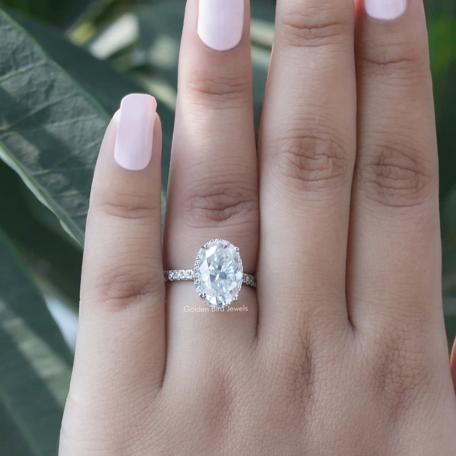 Close-Up View of Oval And Round Cut Moissanite Engagement Ring In White Gold