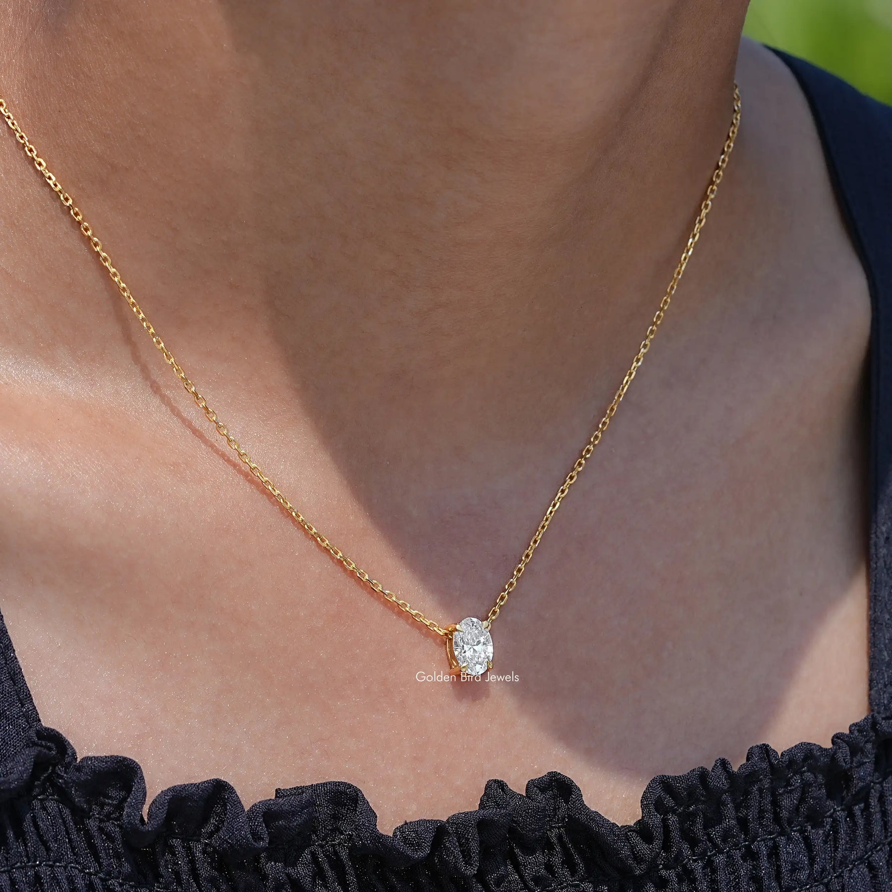 In neck view of Oval cut diamond halo pendant 
