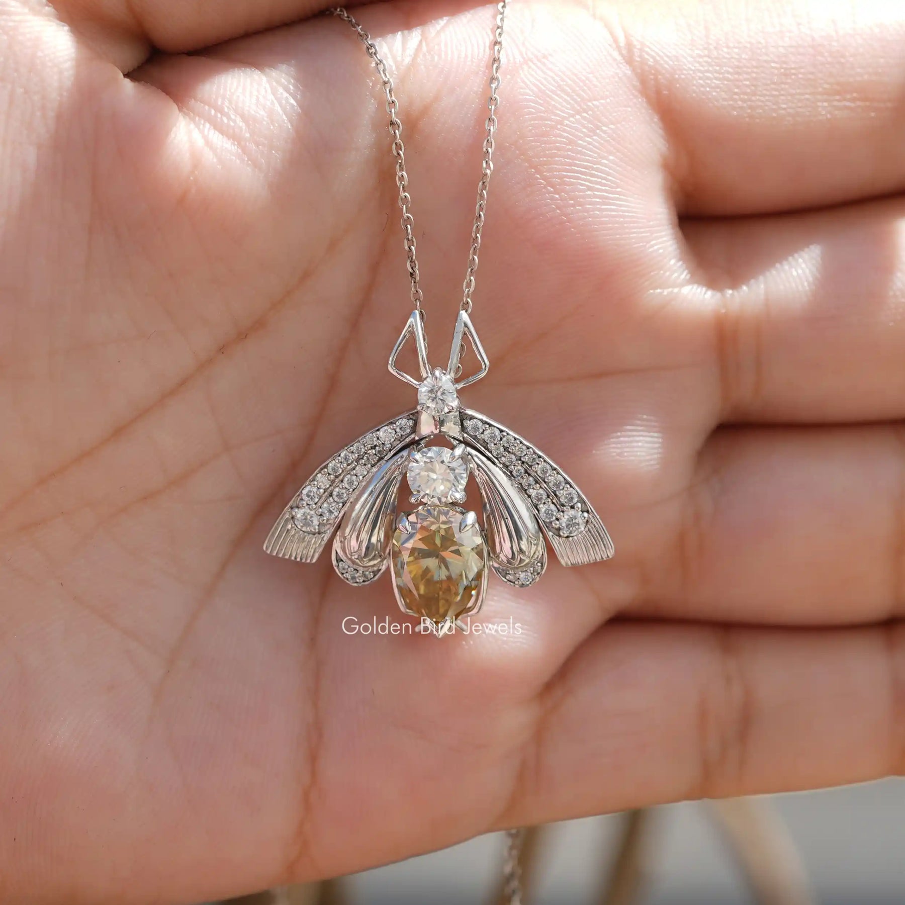 Full view of moissanite pendant in unique shape 
