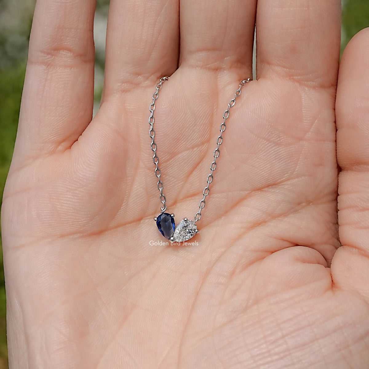 Sterling silver two-stone pendant necklace, blue pear stone with clear matching stone