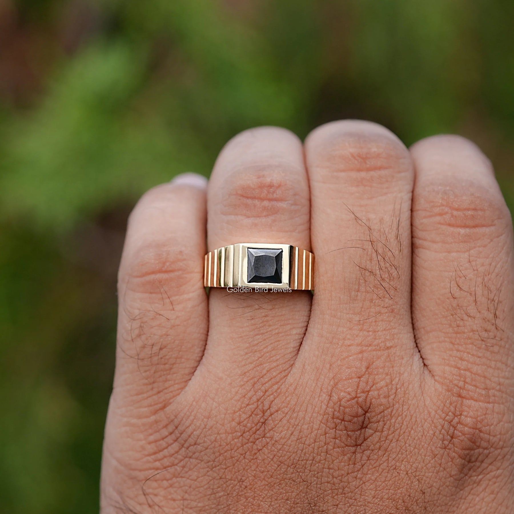 In finger front view of Princess Cut Black Gemstone engagement ring 