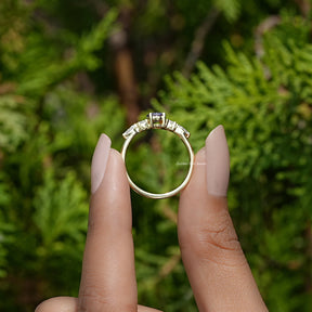 Back View of Amethyst Round Cut Gemstone Accent Ring In two fingers