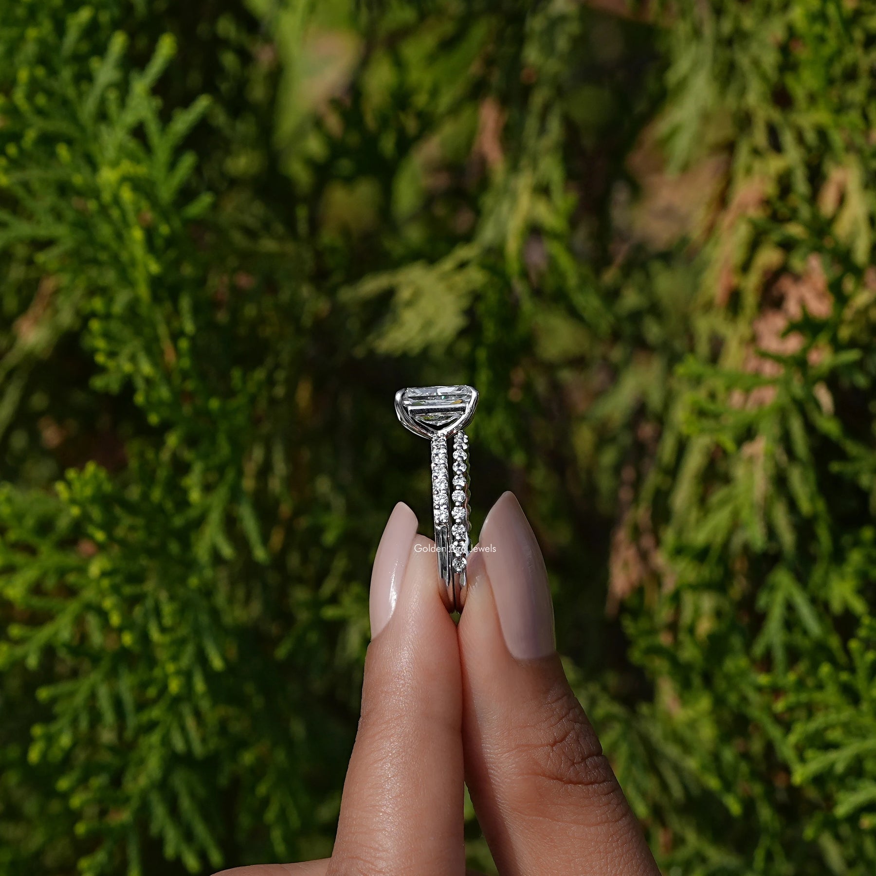 Side View A Radiant Cut Diamond Bridal Ring Set in a two fingers
