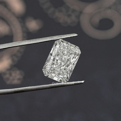 Twijer holding On the Radiant Cut Loose Diamond