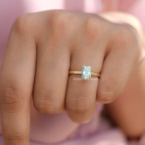 Full View of Blue Radiant Cut Solitare Engagement Ring in a Yellow Gold
