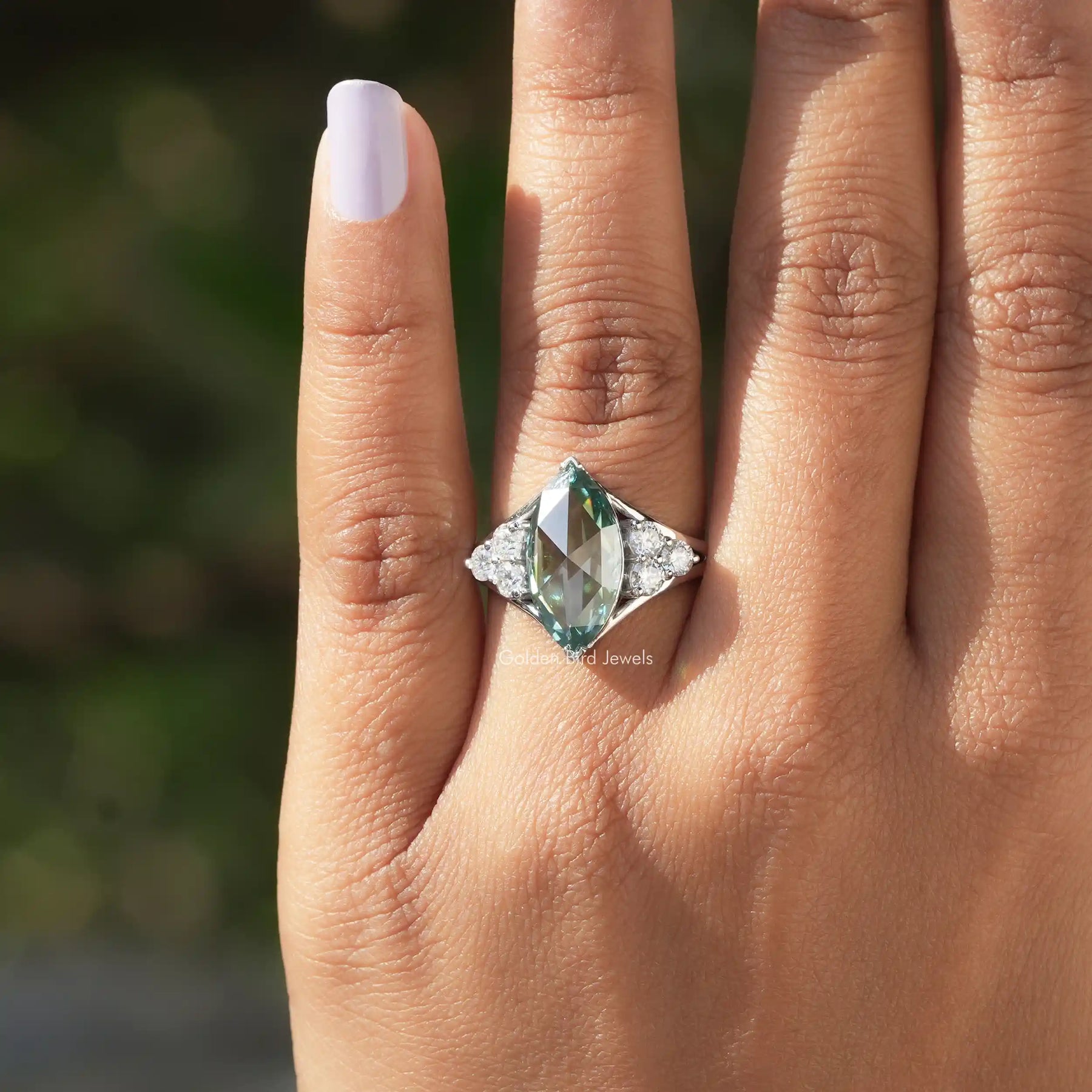 Close-Up View of Rose Cut Marquise   Moissanite Engagement Ring In a finger