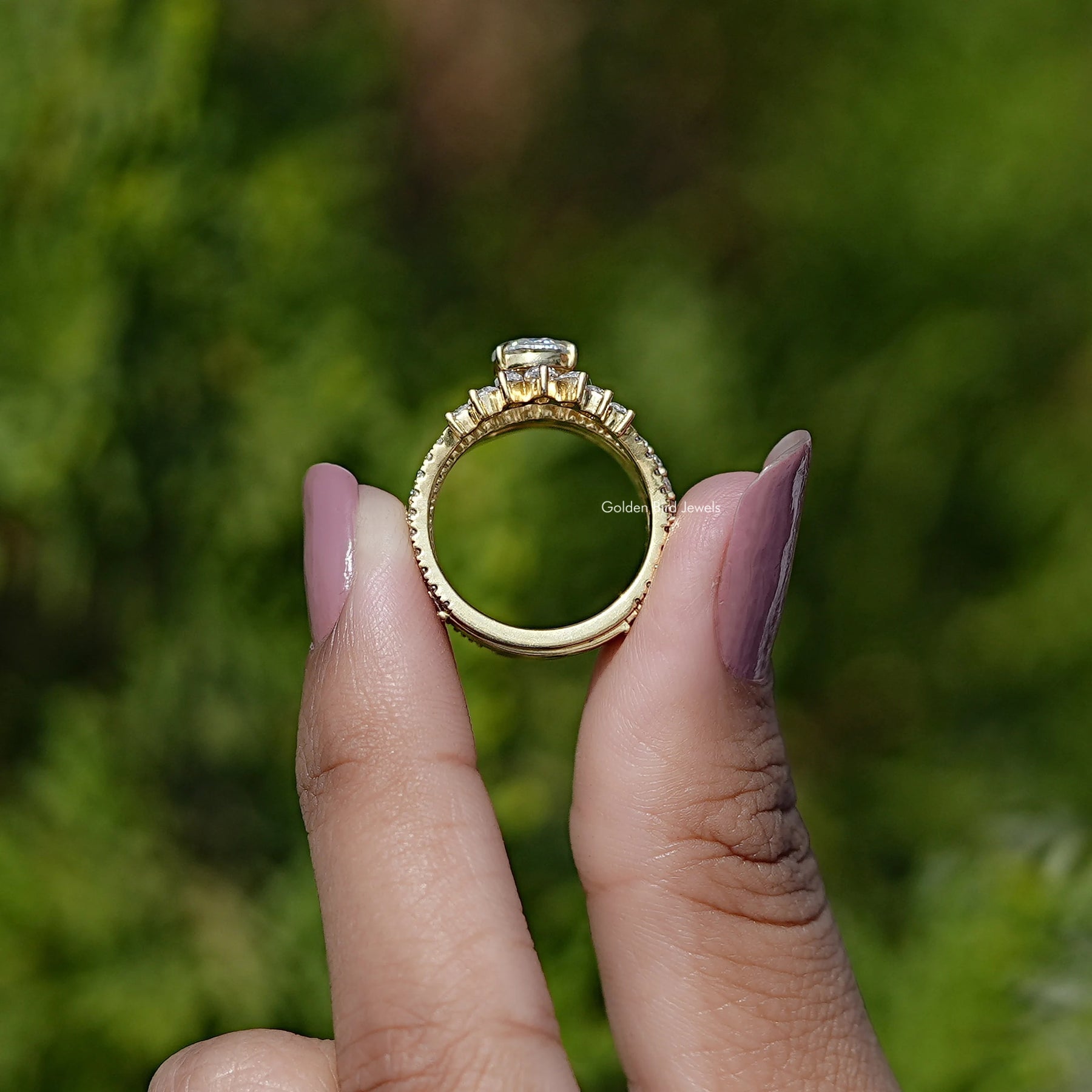 Back View of Rose Cut Pear Moissanite Bridal Ring Set In two fingers