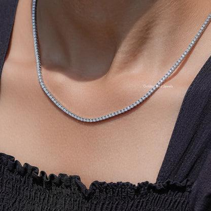 Lab-grown diamond tennis necklace with round-cut stones, close-up on neckline