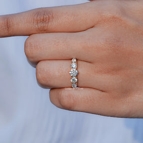 Detailed View of Round And Pear Cut Lab Grown Diamond Ring In Yellow Gold