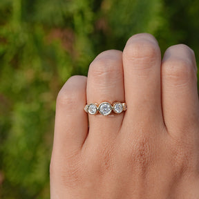 Detailed View of Round Cut Five Stone Bezel Set Ring In Yellow Gold