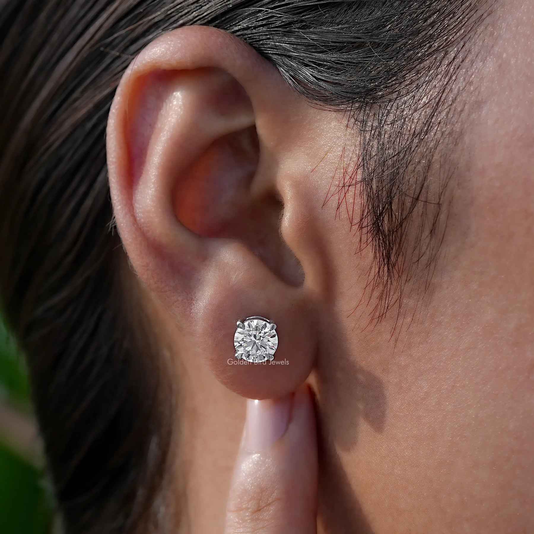 Side View of white lab diamond solitaire earings 