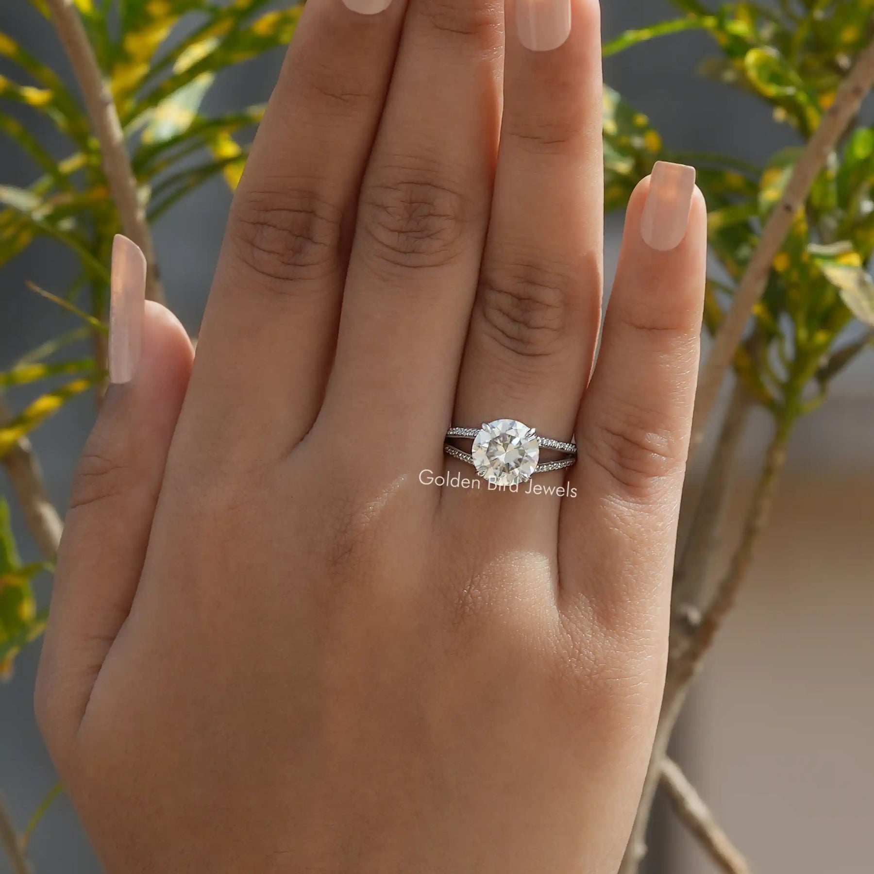 Front View of Round Cut Accent Stone Moissanite Ring In Finger